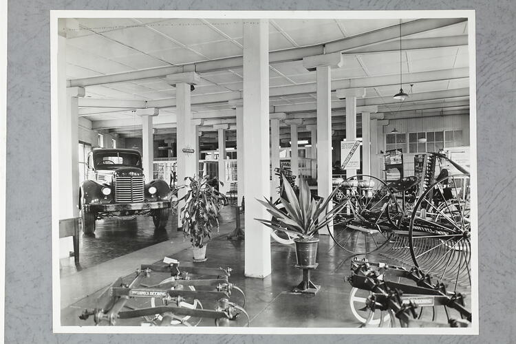 Monochrome photograph of a showroom interior.