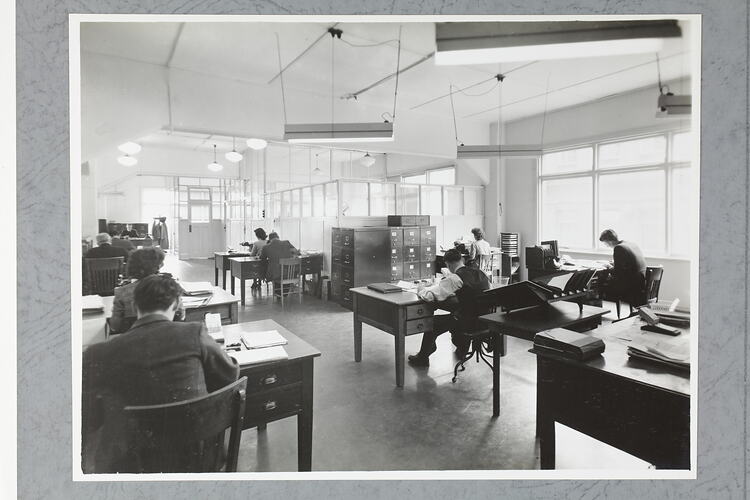 Monochrome photograph of an office interior.