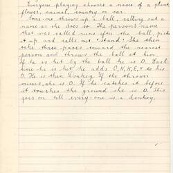 Handwritten game description in black ink on paper