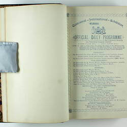 Open book with white pages and black printed text on right side. Page 2.