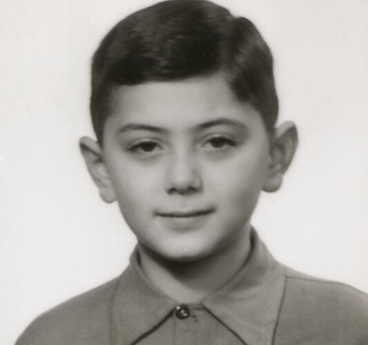 Head and shoulders portrait of a young boy.