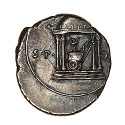 Round coin, aged, elaborate chariot inside temple.