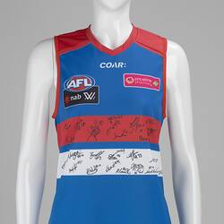 Sleeveless blue football jumper with red and white horizontal stripes. Autographs in black.