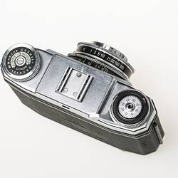 Chrome metal and black leather viewfinder camera. View of top metal plate.