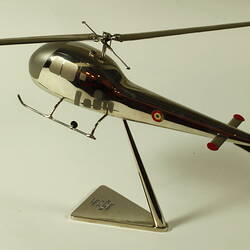 Chrome plated helicopter model. With stand. Rear view.