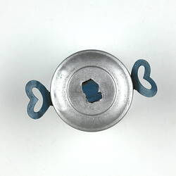 Birdseye view tiny aluminium pot with lid and handles.