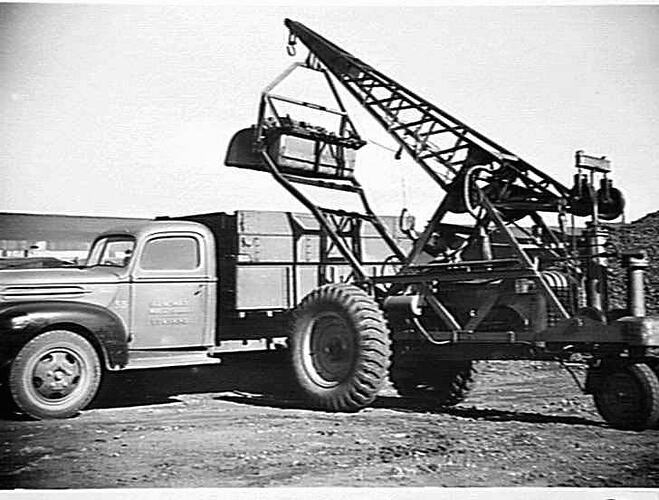 MOBILE CRANE FITTED WITH SCOOP SHOVEL LOADING COKE FROM DUMP TO TRUCK: MAY 1946