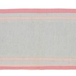 Back of pink and blue rectangular runner. Five identical maze-like designs along the centre.
