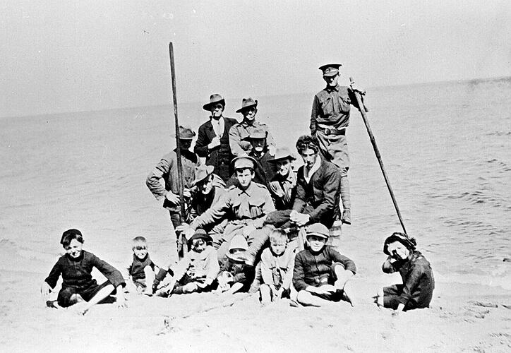 [First World War soldiers with children on the beach at Sandringham, 1910s.]