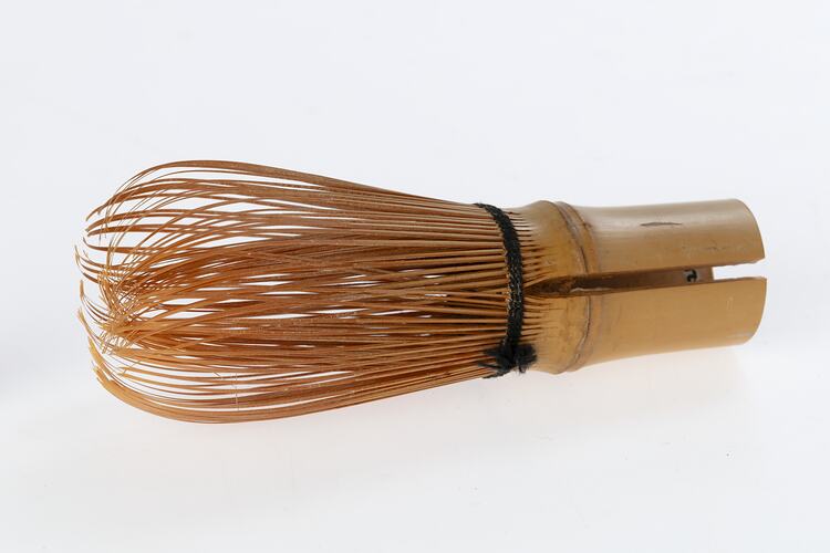 Bamboo tea whisk. Hollow bamboo handle. Whisk is two layers of finely spliced and curved bamboo.