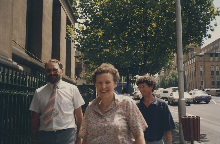 Two male teachers and a female teacher outside the museum on Russell St.