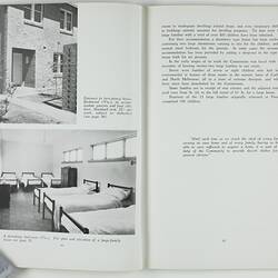 Open booklet with white pages and black printing. House and room with single beds on left page.