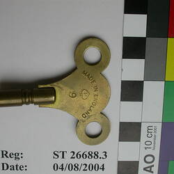 Brass key for winding a clock.