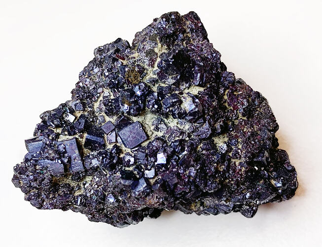 Square shapped, dark red crystal cluster.