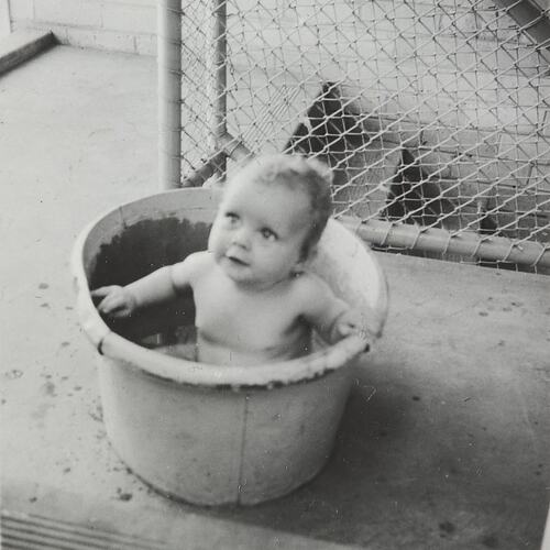 Digital Photograph - Baby in Bucket on Stairwell, Housing Commission Flats, Ascot Vale, 1958