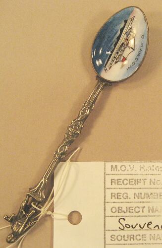 Silver spoon with enamel painted scoop depicting ship.
