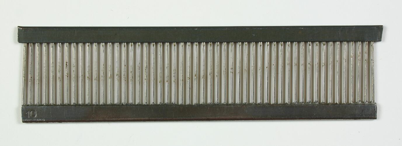 Metal ladder-like series of bars held between two flat metal strips.