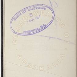 White passport page with purple stamp.