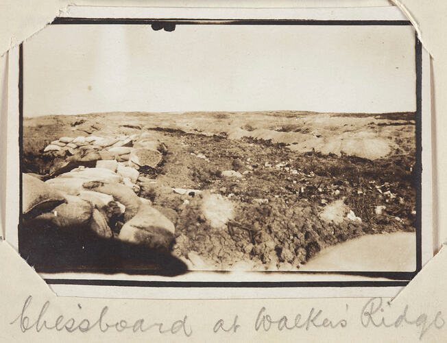 Rocky landscape with sand bags piled up on the left side.