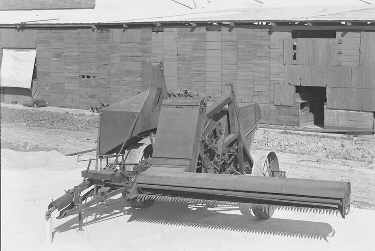 GL-200 header harvester. Shed in background.