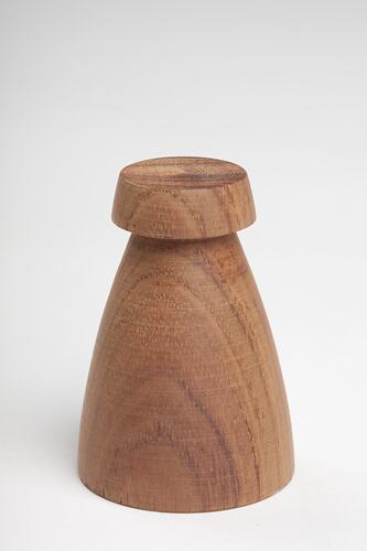 Minimalist brown wooden chess pawn.