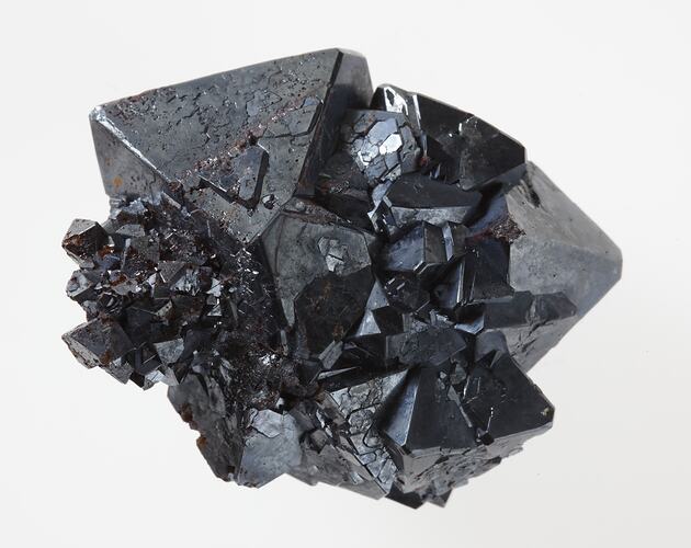 Multiple octahedreal black crystals growing toether.