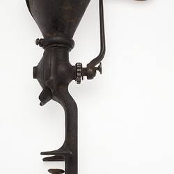 Metal and wood coffee grinder.