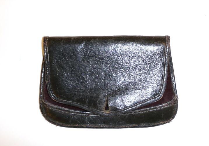 Black leather pouch with button hole front flap.