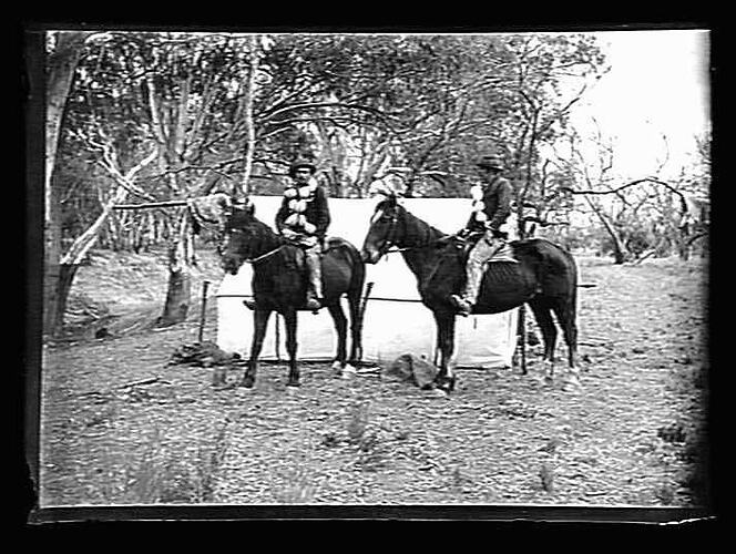 [Collecting emu eggs, Murray River, about 1900. The eggs are slung around the riders' chests to prevent breaking them.]