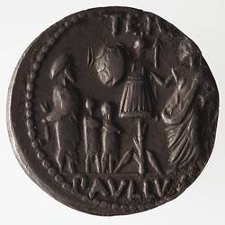 Round coin, aged, trophy in centre, one figure on right with hand on trophy, three figures on left, two small.