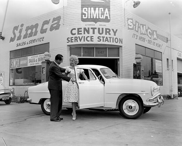 Century Service Station, Woman & Man Posed with Car, Richmond, Victoria, 06 Mar 1959
