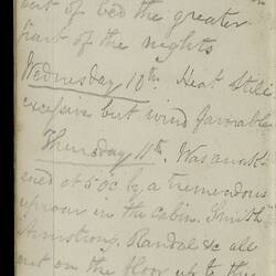 Open diary with handwritten text on discoloured worn page.