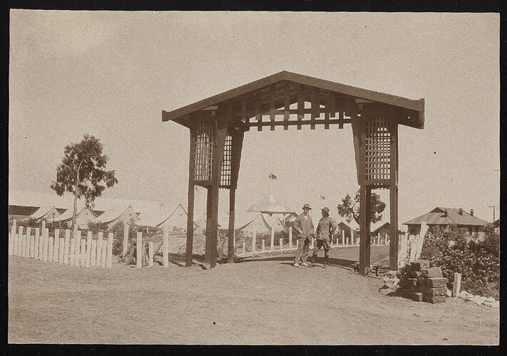 Monochrome photograph of a military camp.