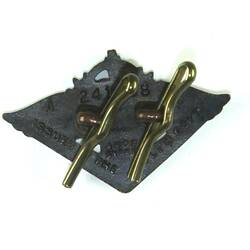 Back of triangular cast badge.