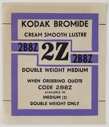 Unused rectangular packaging label. Purple and white background with black text.