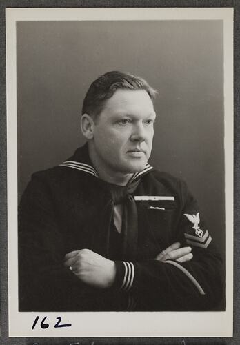 Studio portrait of man in sailor uniform.