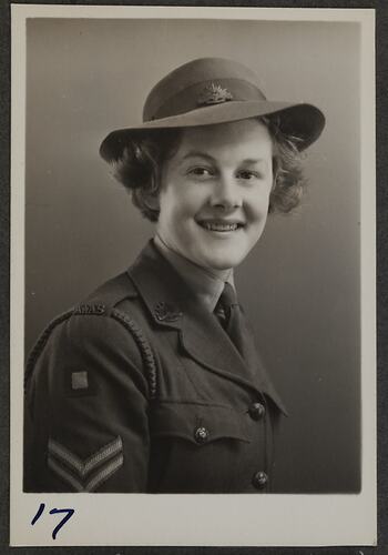 Studio portrait of woman in military uniform.