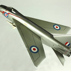 Silver model aeroplane. Blue, white and red rondels on wings and fuselage.
