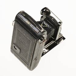 Top rear view of fold out black camera.