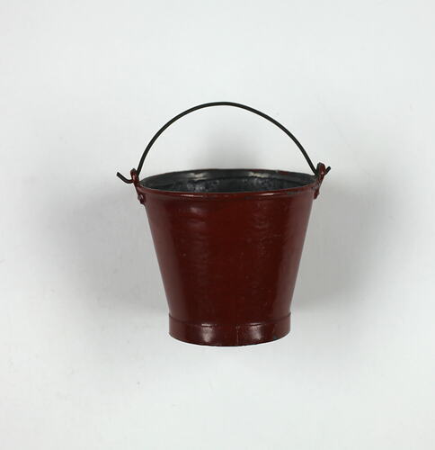 Red toy bucket.