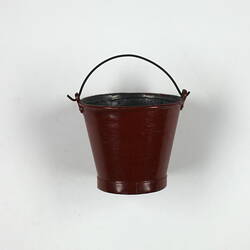 Red toy bucket.