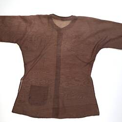 Back of brown collarless long sleeve button up shirt. Hip pocket at left.