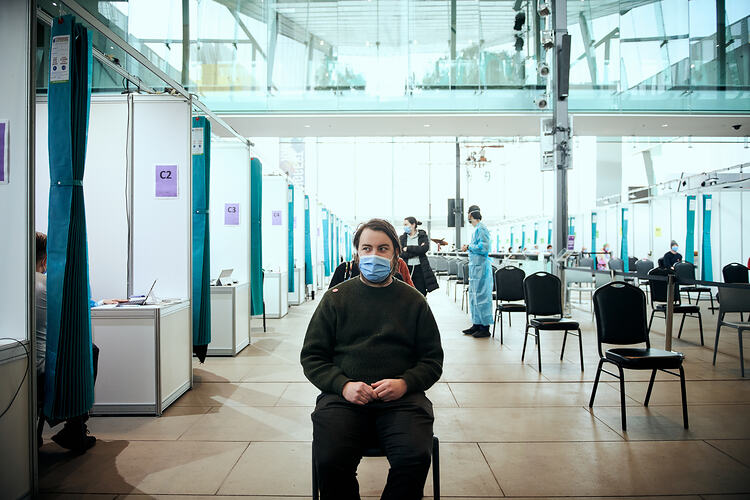 Andrew waiting for vaccination, St Vincent's Vaccination Hub, Melbourne Museum, 23 Sep 2021