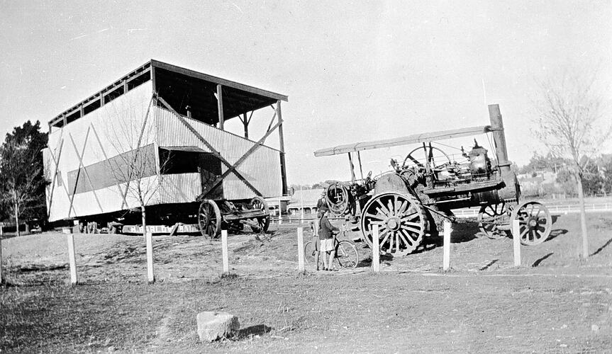[A steam tractor moving a spectator stand at the White Flat sports ground, Ballarat, about 1933.]