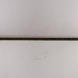 View from above of thing cardboard label.