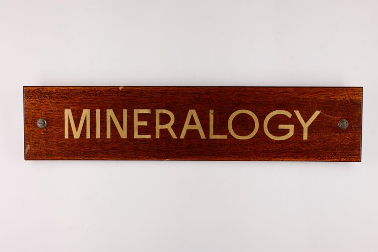 Wooden varnished  rectangular sign with gold gilt lettering.