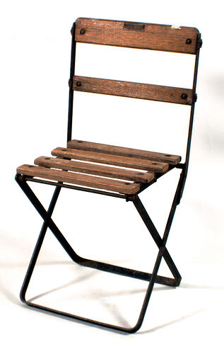 Folding picnic chair with wooden slats.