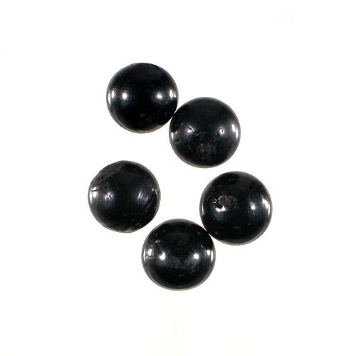 Five black ceramic balls.