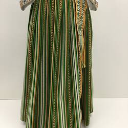 Green and brown patterned long pleated skirt. Woven belt.