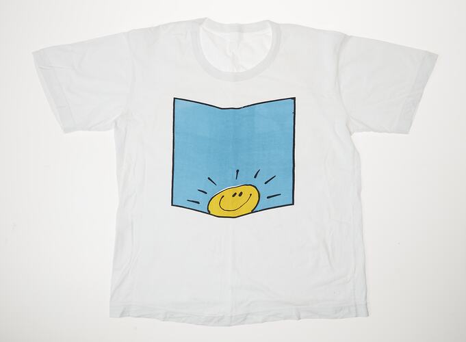 White t-shirt with blue square featuring a yellow smiling 'sunshine' face at base.